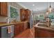 Well-appointed kitchen featuring granite countertops, stainless steel appliances, and hardwood floors at 100 Brookgreen Trace Pl., Pawleys Island, SC 29585