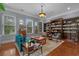 Elegant living room with hardwood floors, built-in bookshelves, and plenty of natural light at 100 Brookgreen Trace Pl., Pawleys Island, SC 29585