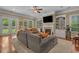 Cozy living room with fireplace, built-in bookshelves, and comfortable seating at 100 Brookgreen Trace Pl., Pawleys Island, SC 29585