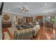Open-concept living space with hardwood floors and kitchen island with bar seating at 100 Brookgreen Trace Pl., Pawleys Island, SC 29585
