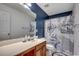 Bathroom with a neutral color scheme, double sink vanity, and unique nautical-themed shower curtain at 100 Culpepper Way # 1002, Myrtle Beach, SC 29579