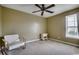 This carpeted bedroom features a ceiling fan, neutral paint, and a window with blinds at 100 Culpepper Way # 1002, Myrtle Beach, SC 29579