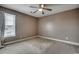 Neutral bedroom featuring carpeted floors, a ceiling fan, and natural light from the window at 100 Culpepper Way # 1002, Myrtle Beach, SC 29579