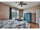 Bedroom boasting a ceiling fan, hardwood floors, two windows, and a blue armoire at 100 Culpepper Way # 1002, Myrtle Beach, SC 29579