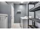 Functional laundry area offers washer, dryer, storage shelves and extra storage at 100 Culpepper Way # 1002, Myrtle Beach, SC 29579