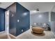 Loft area featuring blue walls, neutral carpet, comfortable seating, and good lighting at 100 Culpepper Way # 1002, Myrtle Beach, SC 29579