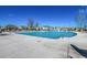 Spacious community pool with an array of lounge chairs and umbrellas surrounding it at 100 Culpepper Way # 1002, Myrtle Beach, SC 29579