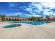 Community pool and recreation area complete with lounge chairs, umbrellas, and a jacuzzi at 100 Culpepper Way # 1002, Myrtle Beach, SC 29579