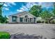 Well-maintained commercial building featuring a light stone facade, awnings, and ample parking at 1010 Swan Lake Dr., North Myrtle Beach, SC 29582