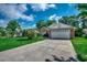 Charming brick home with a two-car garage, a spacious driveway, and mature landscaping at 1010 Swan Lake Dr., North Myrtle Beach, SC 29582