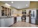Well-lit kitchen featuring stainless steel appliances, ample counter space, and white cabinetry at 1010 Swan Lake Dr., North Myrtle Beach, SC 29582