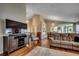 Open-concept living area with hardwood floors that flows into the dining room at 1010 Swan Lake Dr., North Myrtle Beach, SC 29582