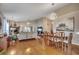 Spacious living room and dining area with hardwood floors, vaulted ceilings, and fireplace at 1010 Swan Lake Dr., North Myrtle Beach, SC 29582
