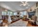 Comfortable living room featuring hardwood floors, a fireplace, and an open layout at 1010 Swan Lake Dr., North Myrtle Beach, SC 29582