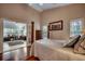 Spacious main bedroom features hardwood floors, an ensuite and an office space through a doorway at 1010 Swan Lake Dr., North Myrtle Beach, SC 29582