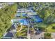 Aerial view showcasing community amenities including a pool and tennis courts at 1064 Links Rd., Surfside Beach, SC 29575
