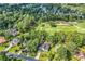 Aerial view of a home near a golf course surrounded by mature trees in a beautiful neighborhood at 1064 Links Rd., Surfside Beach, SC 29575