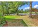 Well-manicured backyard with a view of the golf course and a white picket fence at 1064 Links Rd., Surfside Beach, SC 29575