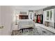 Cozy bedroom featuring a queen-sized bed, nightstands, and windows for plenty of natural light at 1064 Links Rd., Surfside Beach, SC 29575