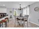 Charming dining area with a modern chandelier and windows offering lots of natural light at 1064 Links Rd., Surfside Beach, SC 29575