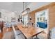 Dining area with a modern light fixture, hardwood floors, and connection to the living area at 1064 Links Rd., Surfside Beach, SC 29575