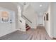Inviting foyer with hardwood floors, a staircase, and an elegant front door at 1064 Links Rd., Surfside Beach, SC 29575