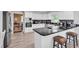 Modern kitchen featuring white cabinets, granite countertops, stainless steel appliances, and bar seating at 1064 Links Rd., Surfside Beach, SC 29575