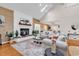 Spacious living room with fireplace, hardwood floors, white sofas, and stylish decor at 1064 Links Rd., Surfside Beach, SC 29575