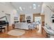 Bright living room featuring vaulted ceilings, skylights, hardwood floors, a fireplace, and comfortable furnishings at 1064 Links Rd., Surfside Beach, SC 29575