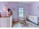 Cozy bedroom features lots of natural light, playful decor, and laminate flooring at 110 South Shore Blvd. # 203, Longs, SC 29568