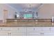 Kitchen with ample counter space and bar seating overlooks the living area at 110 South Shore Blvd. # 203, Longs, SC 29568