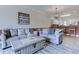 Open living space with modern furnishings and decor, connecting to the kitchen with breakfast bar at 110 South Shore Blvd. # 203, Longs, SC 29568