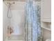 Bright bathroom shower features a modern shower head, white surround, and cute starfish patterned shower curtain at 110 South Shore Blvd. # 203, Longs, SC 29568
