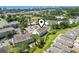 An aerial view showcases the condo building amidst lush greenery, with parking and recreational facilities nearby at 1100 Possum Trot Rd. # F218, North Myrtle Beach, SC 29582