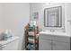 A bathroom features a white sink and vanity with a framed mirror above at 1100 Possum Trot Rd. # F218, North Myrtle Beach, SC 29582