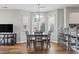 Dining area with a table set for four next to a bay window and counter seating for four additional people at 1100 Possum Trot Rd. # F218, North Myrtle Beach, SC 29582