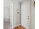 Hallway leading to rooms is decorated with a beach-themed welcome sign on the white door at 1100 Possum Trot Rd. # F218, North Myrtle Beach, SC 29582
