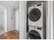 A laundry closet is outfitted with a stacked washer and dryer unit at 1100 Possum Trot Rd. # F218, North Myrtle Beach, SC 29582