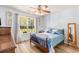 Bedroom featuring a ceiling fan, a large window, hardwood floor, and light blue walls at 1134 Carleita Circle, Conway, SC 29527