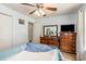 Bedroom with light blue walls, hardwood floors, ceiling fan, and wooden dressers at 1134 Carleita Circle, Conway, SC 29527
