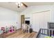 Bright bedroom featuring wood-look floors, paneled walls, and modern ceiling fan at 1134 Carleita Circle, Conway, SC 29527