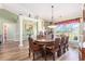 Dining room with carved wood table, decor and large windows providing ample light at 1134 Carleita Circle, Conway, SC 29527