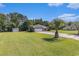 Wide shot of a well maintained single-story brick home with large front lawn and mature trees at 1134 Carleita Circle, Conway, SC 29527
