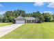 Charming single-story brick home boasts a two-car garage and well-manicured lawn at 1134 Carleita Circle, Conway, SC 29527