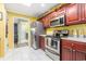 Galley style kitchen with stainless steel appliances, and bright lighting at 1134 Carleita Circle, Conway, SC 29527