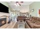 Comfortable living room featuring a fireplace, wood floors, and access to the dining area at 1134 Carleita Circle, Conway, SC 29527