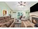 Cozy living room featuring a fireplace, comfortable seating, and natural light at 1134 Carleita Circle, Conway, SC 29527