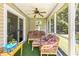 Enclosed sunroom featuring a ceiling fan, patio furniture, and views of the backyard at 1134 Carleita Circle, Conway, SC 29527