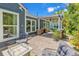 Inviting backyard patio featuring comfortable outdoor seating, an outdoor kitchen, and lush landscaping at 1314 Prescott Circle, Myrtle Beach, SC 29577