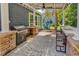 Outdoor patio featuring a grill, bar seating, hammock, and a meticulously patterned paver design at 1314 Prescott Circle, Myrtle Beach, SC 29577